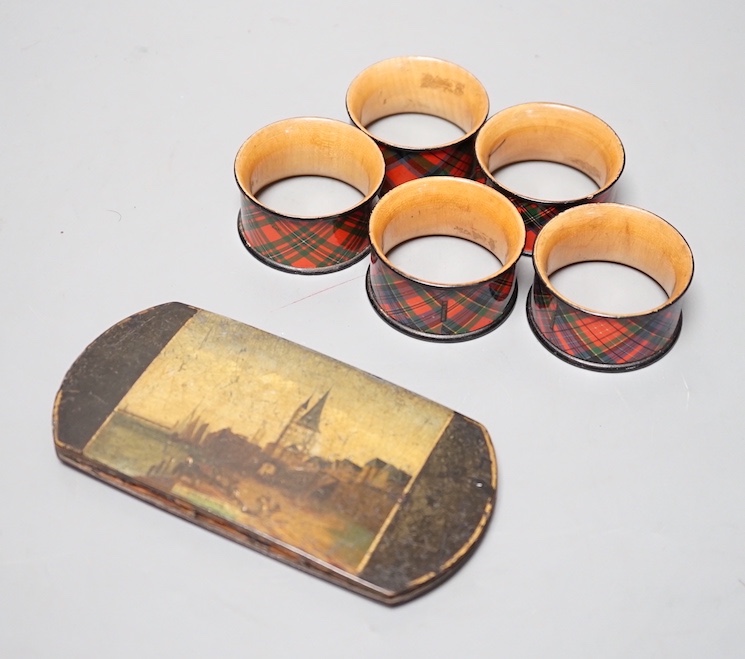 A German papier mache spectacles case and five Tartan ware napkin rings